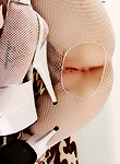 Sexy british chick wearing nothing but her knickers and a see through corset