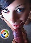 On her knees sucking cock