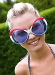 Cutie in funny glasses teases pussy